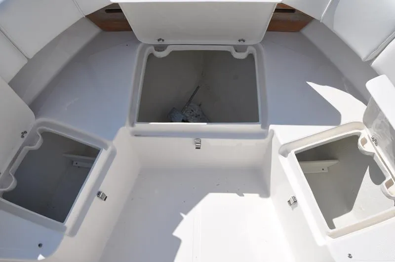 Slide: The Image of Open storage compartments on a 2021 Century Coronado boat. - 23
