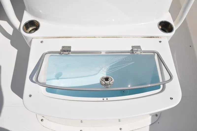 Slide: The Image of 2021 Century Coronado boat livewell with transparent lid and stainless steel cup holders. - 24
