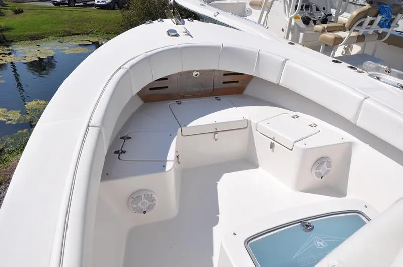 Slide: The Image of 2021 Century Coronado boat interior with white seating and storage compartments. - 28
