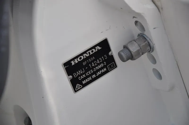 Slide: The Image of Honda engine label on a 2021 Century Coronado boat. - 30