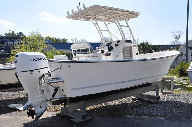 Slide: The Image of 2021 Century Coronado boat with Honda outboard motor on a stand. - 5