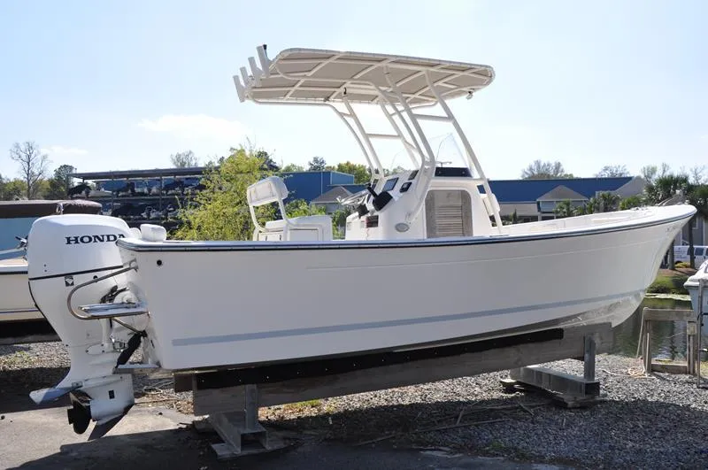 Slide: The Image of 2021 Century Coronado boat with Honda outboard motor on a stand. - 6