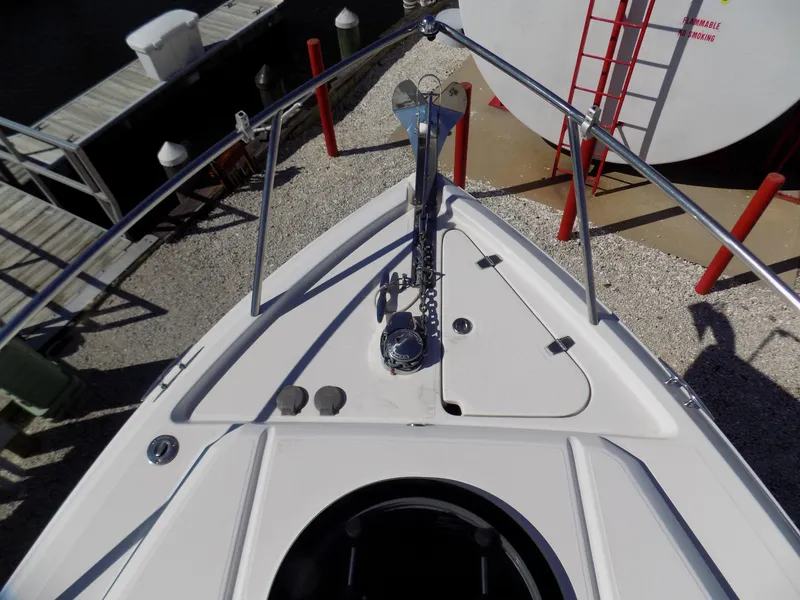 Slide: The Image of Bow of 2019 Regal 26XO boat with anchor and railing at dock. - 2