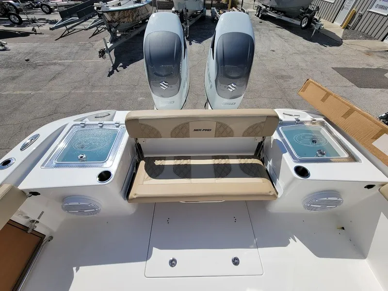 Slide: The Image of 2025 Sea Pro 322 DLX boat with dual outboard engines and seating area. - 10