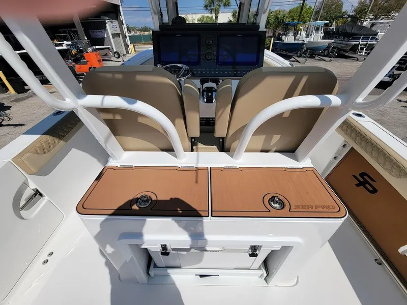 Slide: The Image of 2025 Sea Pro 322 DLX boat interior with dual seats and control panel. - 15