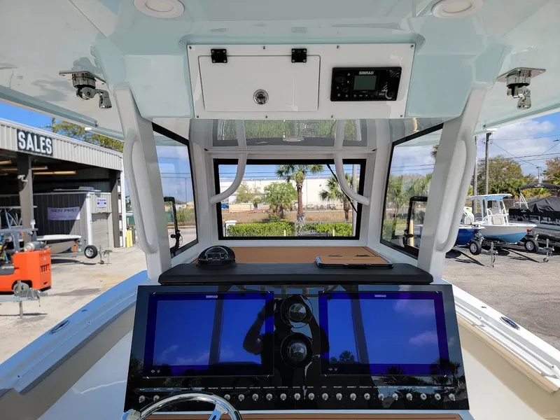 Slide: The Image of Interior cockpit view of 2025 Sea Pro 322 DLX boat with advanced navigation system. - 17