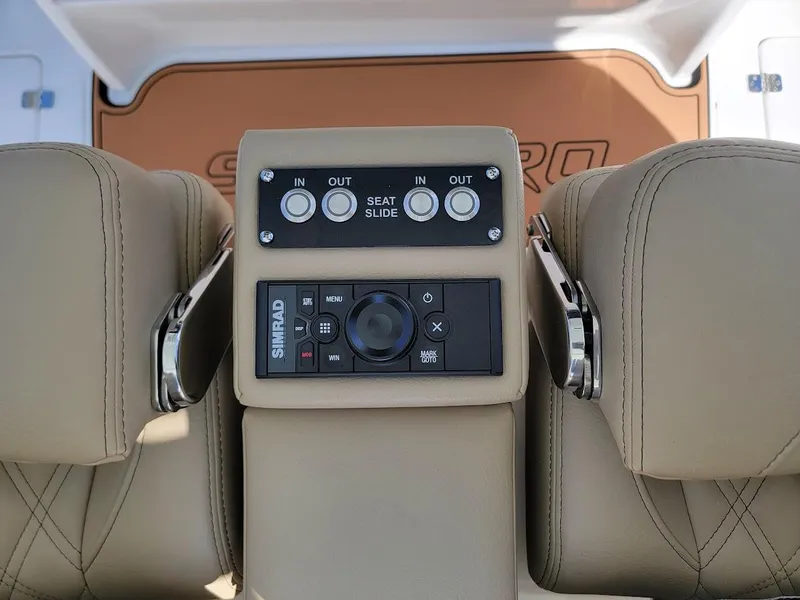 Slide: The Image of Control panel of the 2025 Sea Pro 322 DLX boat with seat adjustment buttons. - 19