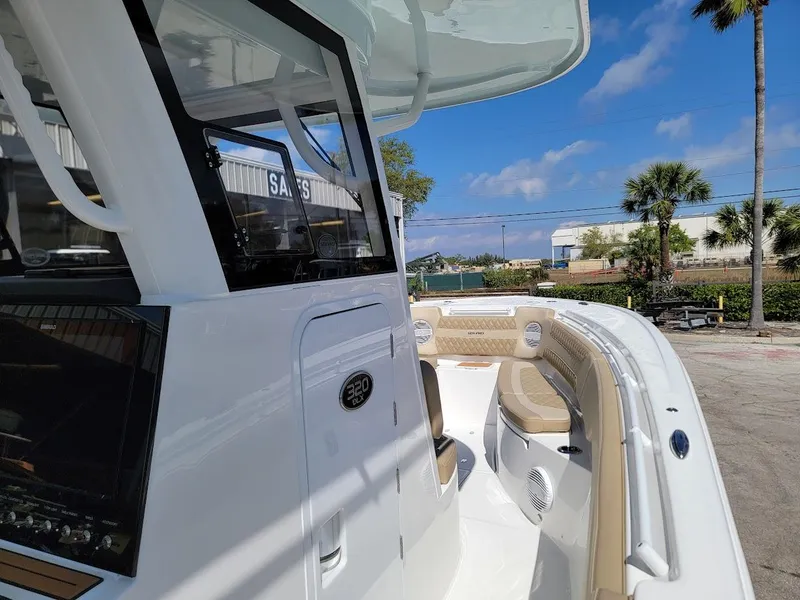 Slide: The Image of 2025 Sea Pro 322 DLX boat with spacious seating and modern design. - 20