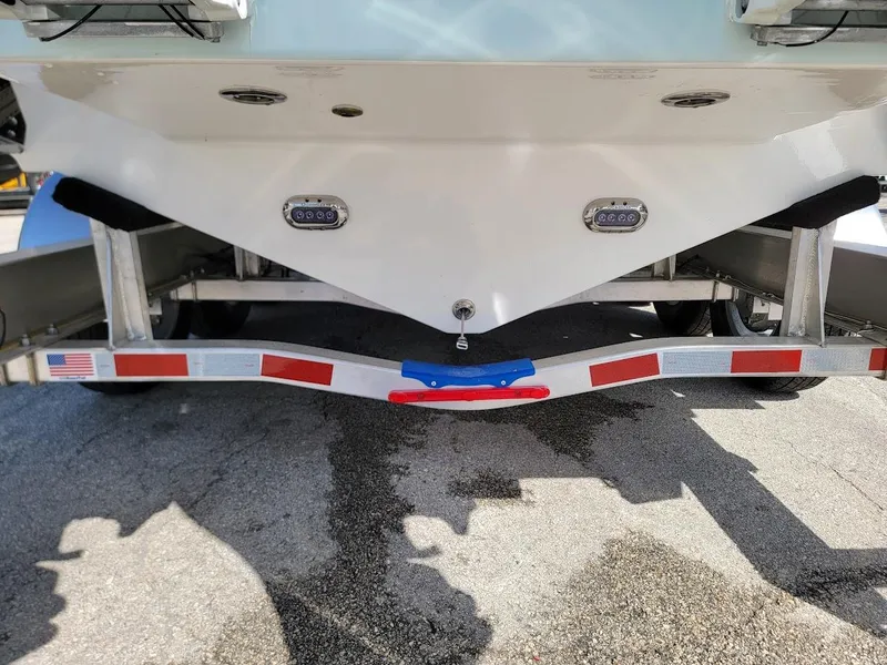 Slide: The Image of 2025 Sea Pro 322 DLX boat on a trailer, rear view. - 3
