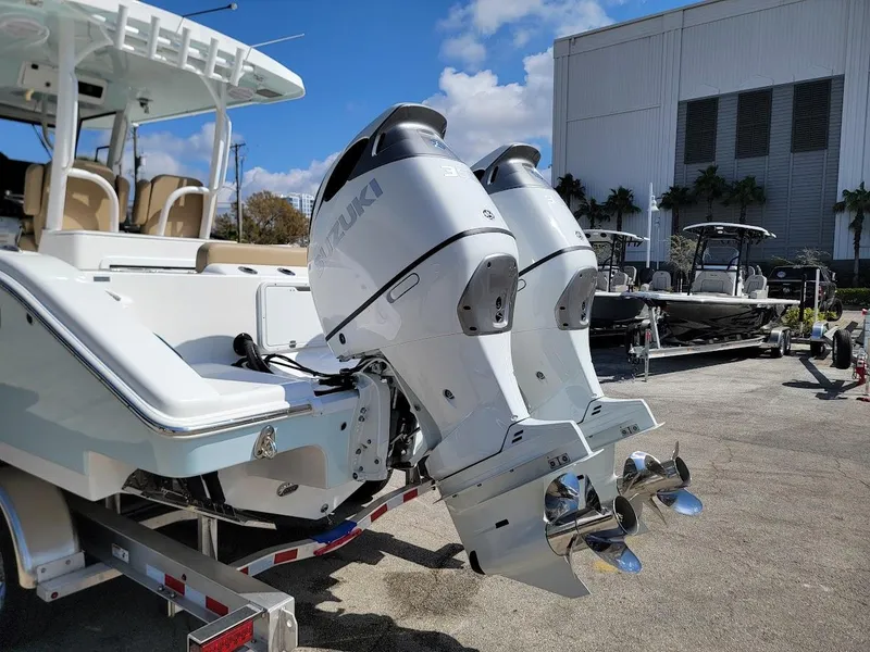 Slide: The Image of 2025 Sea Pro 322 DLX boat with dual Suzuki outboard motors. - 4
