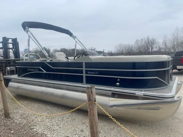 Slide: The Image of 2023 Cypress Cay Seabreeze 212 pontoon boat in a parking lot. - 3