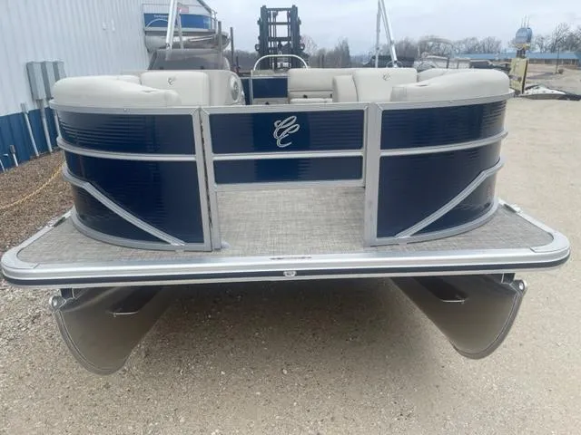 Slide: The Image of 2023 Cypress Cay Seabreeze 212 pontoon boat, rear view, docked on gravel. - 4