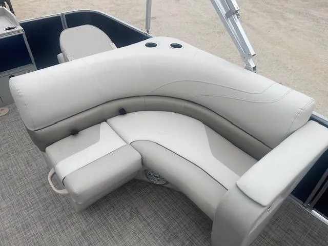 Slide: The Image of 2023 Cypress Cay Seabreeze 212 boat with comfortable seating and cup holders. - 5