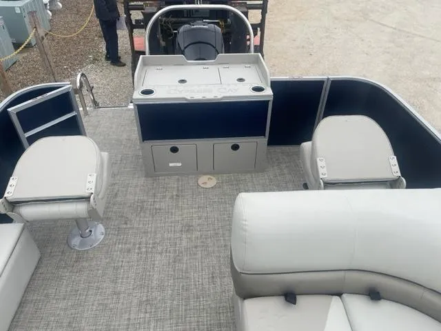 Slide: The Image of 2023 Cypress Cay Seabreeze 212 pontoon boat interior with seating and storage compartments. - 9