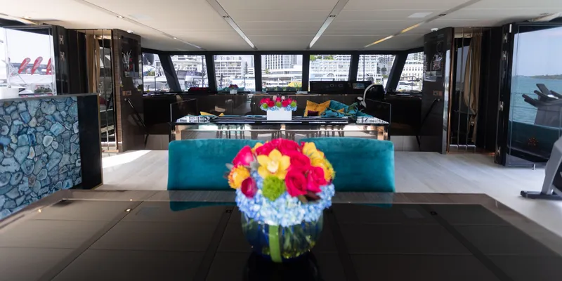 Slide: The Image of Luxurious interior of 2018 Sunreef 68 Supreme yacht with elegant decor and vibrant floral arrangement. - 11