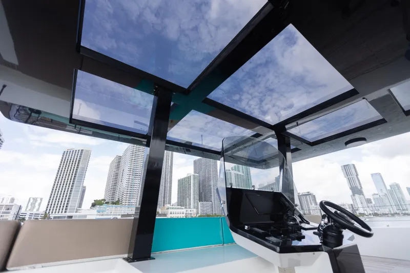 Slide: The Image of Luxurious Sunreef 68 Supreme yacht helm with city skyline view, 2018 model. - 13