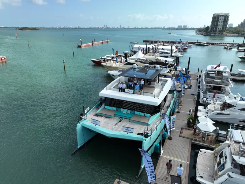 Slide: The Image of Sunreef 68 Supreme 2018 yacht docked at marina with people on deck. - 17