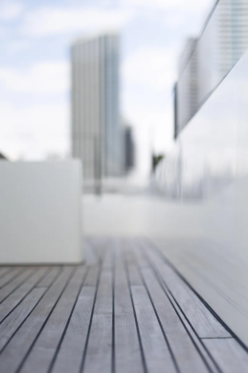 Slide: The Image of Deck of 2018 Sunreef 68 Supreme yacht with cityscape background. - 30