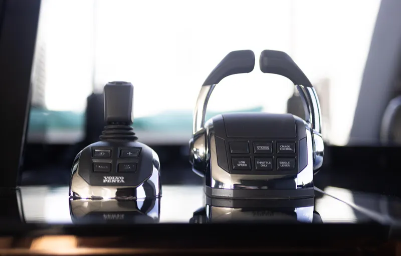 Slide: The Image of Volvo Penta controls on Sunreef 68 Supreme yacht, 2018 model, featuring joystick and throttle. - 34