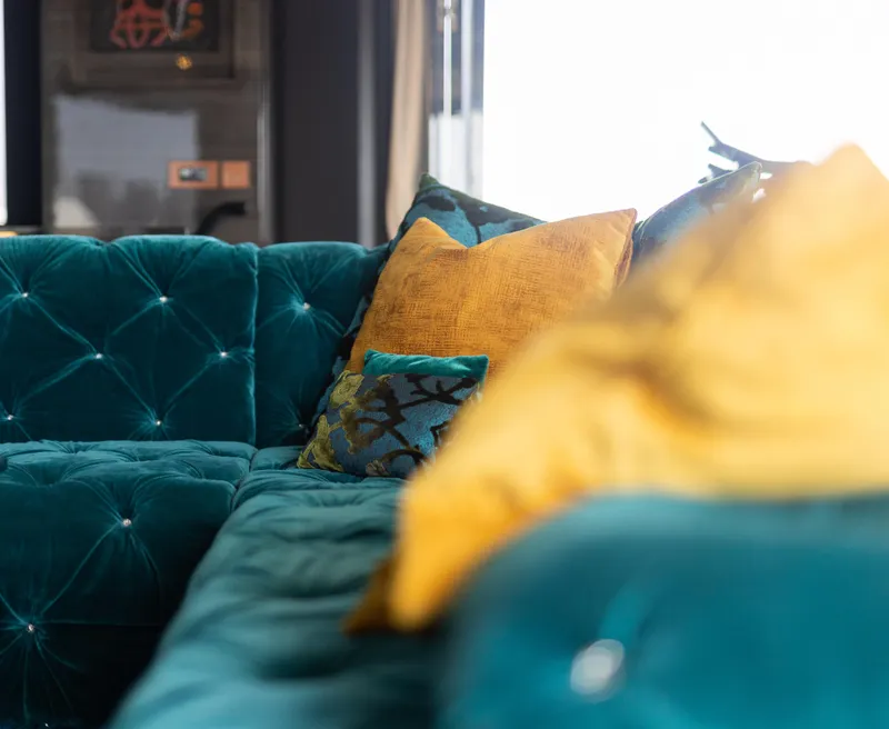 Slide: The Image of Luxurious teal sofa with vibrant yellow and blue cushions on Sunreef 68 Supreme yacht, 2018. - 35
