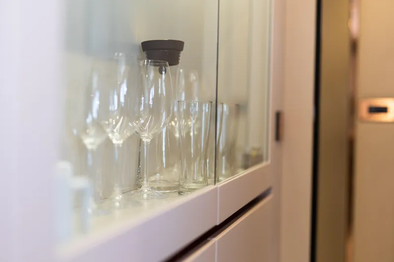 Slide: The Image of Glassware in cabinet aboard 2018 Sunreef 68 Supreme yacht interior. - 37