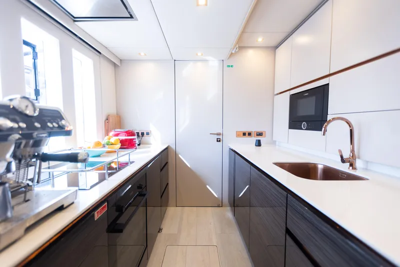 Slide: The Image of Modern kitchen interior on 2018 Sunreef 68 Supreme yacht, featuring sleek design and appliances. - 46