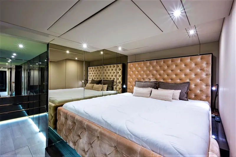 Slide: The Image of Luxurious bedroom interior on 2018 Sunreef 68 Supreme yacht with plush bedding and mirrored walls. - 47