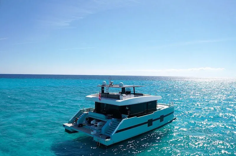 Slide: The Image of Luxurious 2018 Sunreef 68 Supreme yacht cruising on clear blue ocean waters. - 8