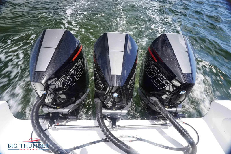 Slide: The Image of Triple outboard engines on a 2023 Fountain 38 TE boat by Big Thunder Marine. - 16