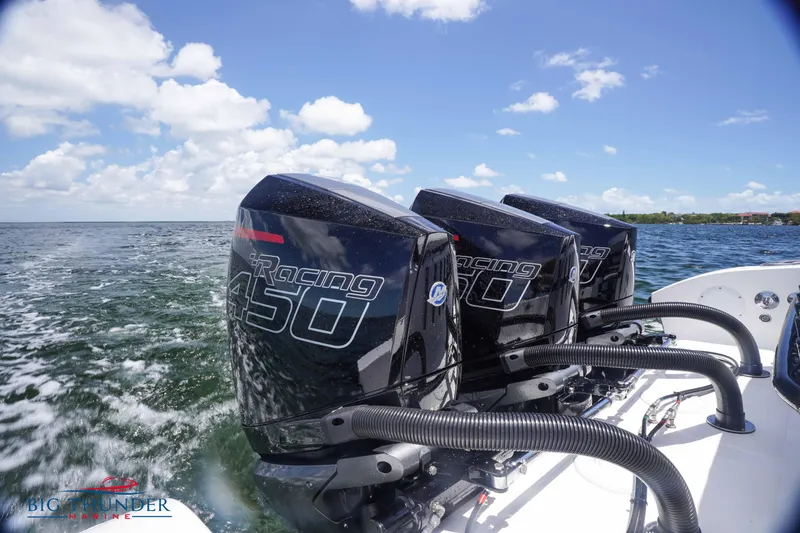 Slide: The Image of 2023 Fountain 38 TE boat with triple Mercury Racing 450 engines on open water. - 17