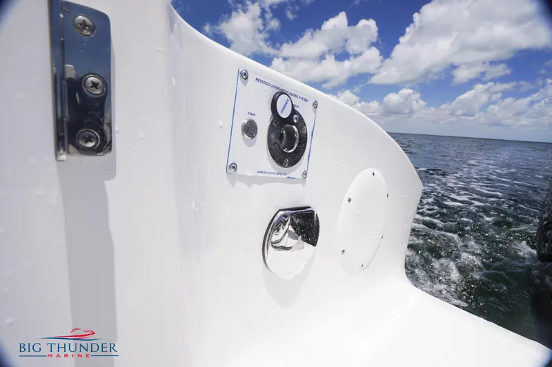 Slide: The Image of 2023 Fountain 38 TE boat control panel with ocean view and Big Thunder Marine logo. - 18