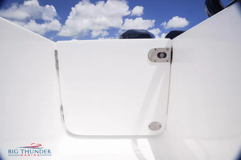 Slide: The Image of White door on a 2023 Fountain 38 TE boat under a blue sky. - 19