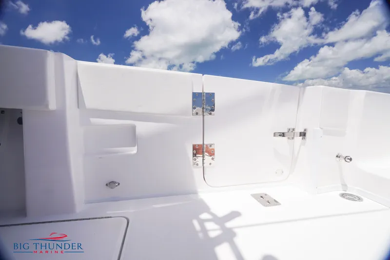 Slide: The Image of 2023 Fountain 38 TE boat deck with white finish and blue sky background. - 23