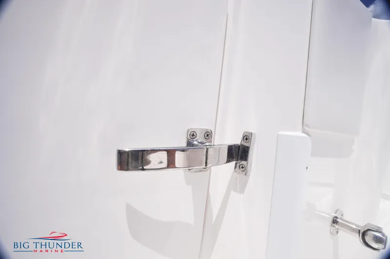 Slide: The Image of Close-up of a 2023 Fountain 38 TE boat latch and handle. - 24