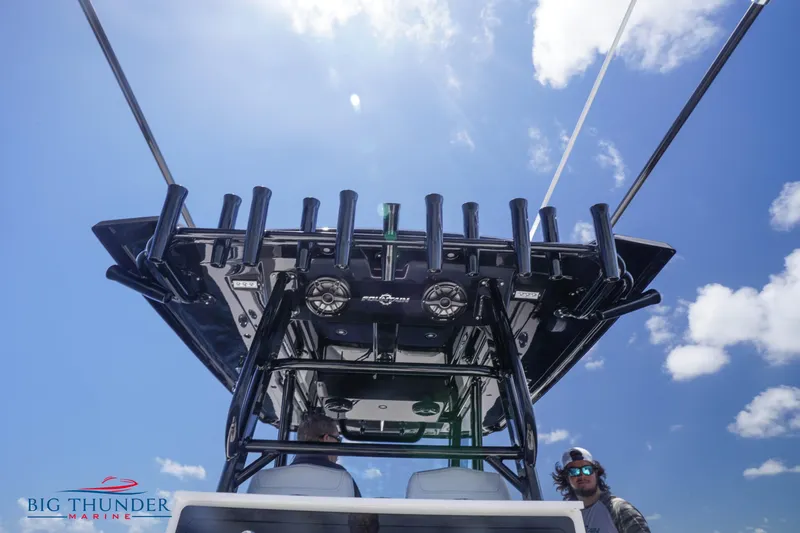 Slide: The Image of 2023 Fountain 38 TE boat with rod holders and Big Thunder Marine logo. - 28