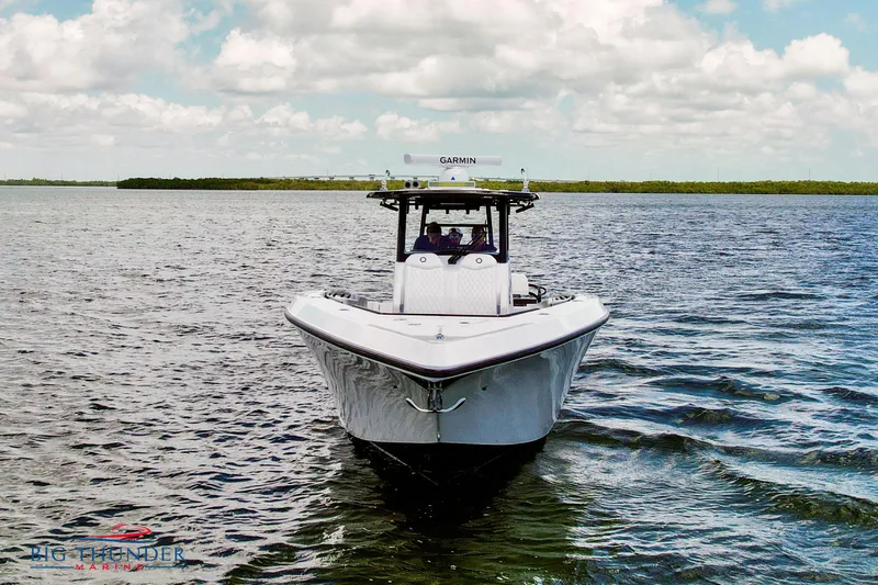 Slide: The Image of 2023 Fountain 38 TE boat on open water under cloudy sky. - 3
