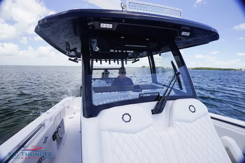 Slide: The Image of 2023 Fountain 38 TE boat cruising on open water. - 49