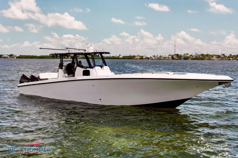 Slide: The Image of 2023 Fountain 38 TE boat cruising on a sunny day. - 5