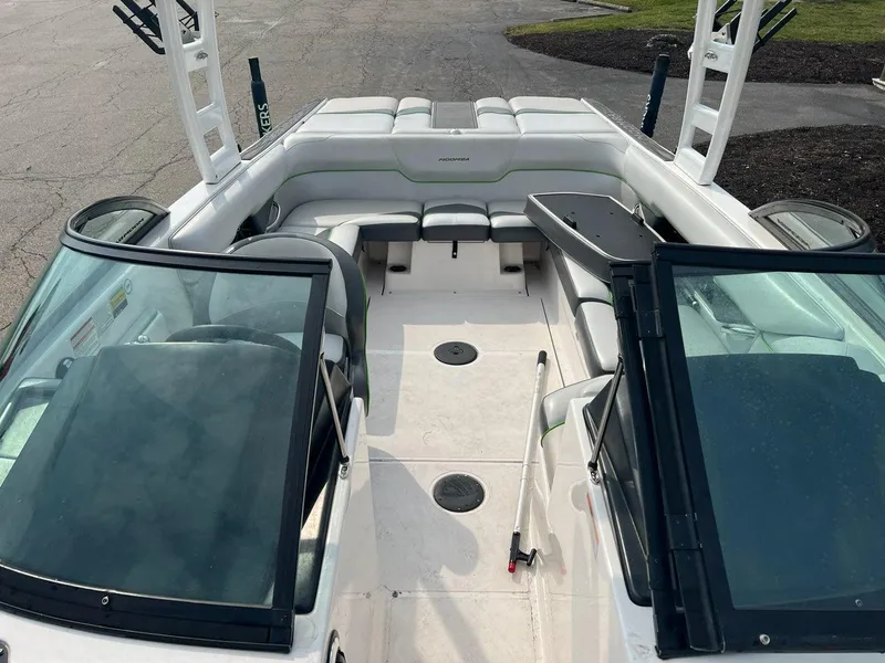 Slide: The Image of 2014 Moomba Mojo 2.5 boat interior with seating and open deck. - 4
