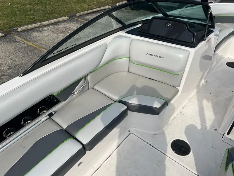 Slide: The Image of 2014 Moomba Mojo 2.5 boat interior with white and gray seating. - 5