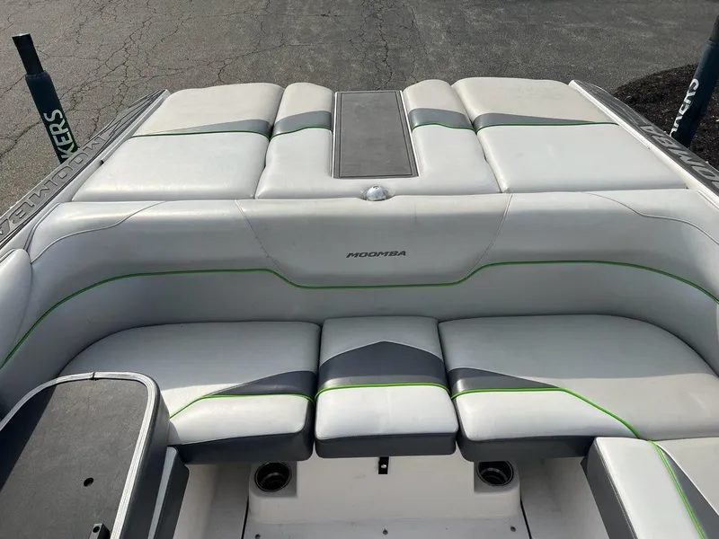 Slide: The Image of 2014 Moomba Mojo 2.5 boat rear seating area with white and green upholstery. - 7