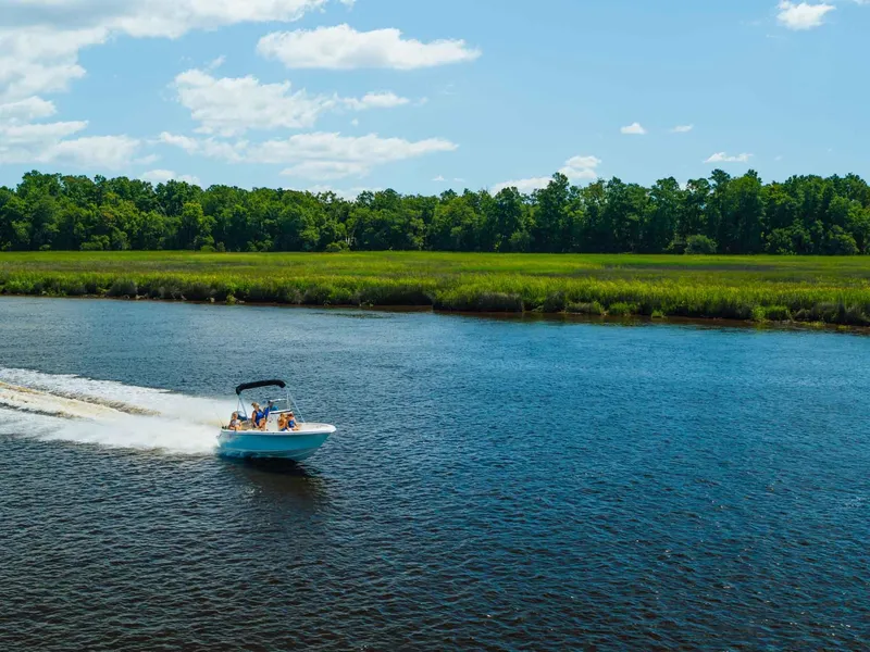 Slide: The Image of 2026 Key West 189 FS boat cockpit with steering wheel and control panel. - 12