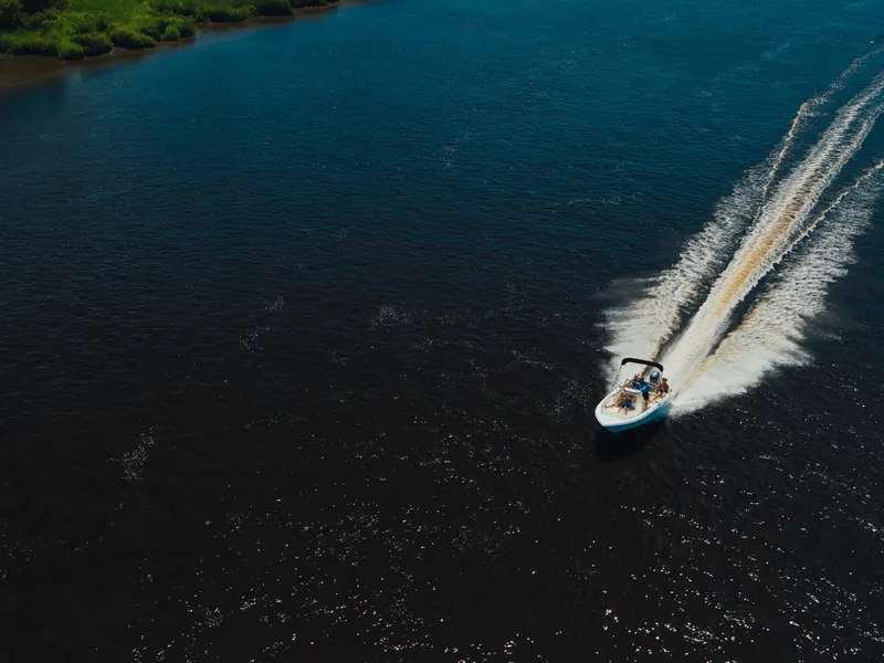 Slide: The Image of 2026 Key West 189 FS boat interior with steering console and seating. - 14