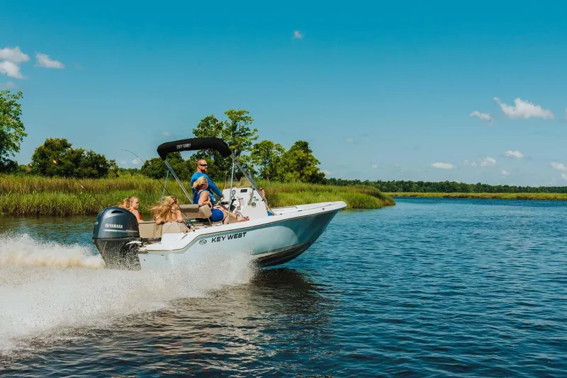 Slide: The Image of 2026 Key West 189 FS boat storage compartment with wiring and battery. - 15