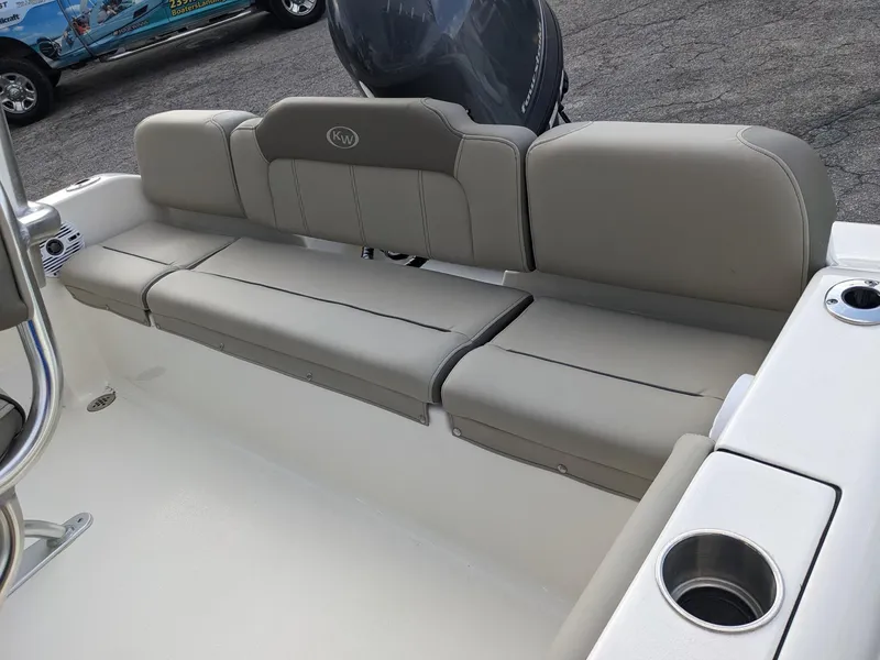 Slide: The Image of 2026 Key West 189 FS boat with ladder and outboard motor on a concrete block. - 5