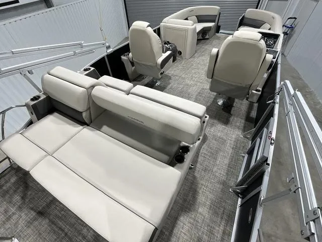 Slide: The Image of 2023 Harris Cruiser 230 interior with plush seating and modern design. - 11