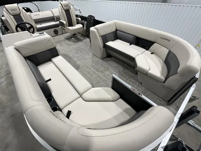 Slide: The Image of 2023 Harris Cruiser 230 pontoon boat interior with plush seating and modern design. - 7