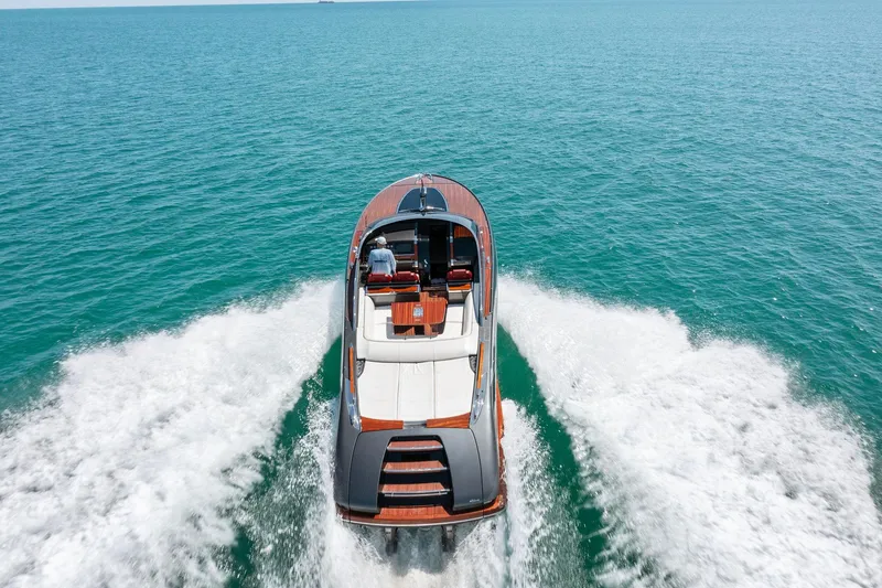Slide: The Image of 2022 Riva 38 Rivamare luxury yacht cruising on open water. - 11