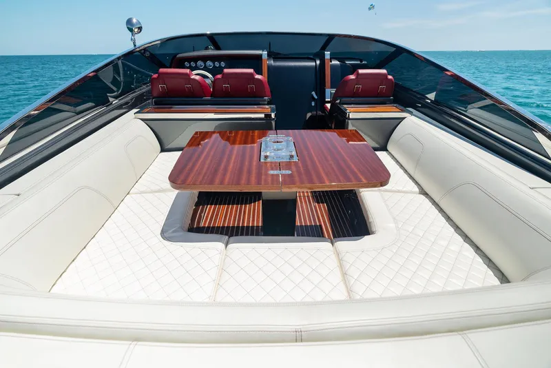 Slide: The Image of Luxurious interior of 2022 Riva 38 Rivamare yacht with elegant seating and wooden table. - 14