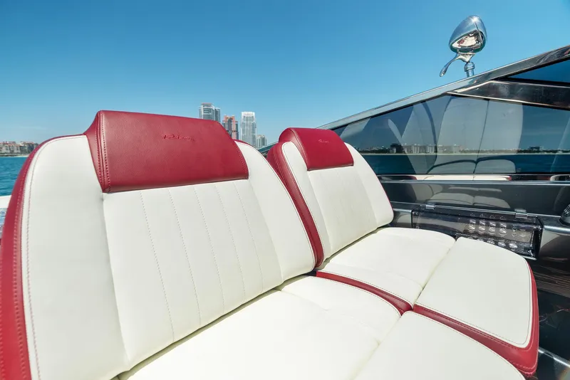 Slide: The Image of 2022 Riva 38 Rivamare luxury boat with red and white leather seats. - 21